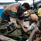 LIBERIA. Monrovia. June 25th, 2003. A member of the AA (Anti-Aircraft) brigade exchanges a brief tender word with his girlfriend during a heavy fighting in the capital Monrovia.